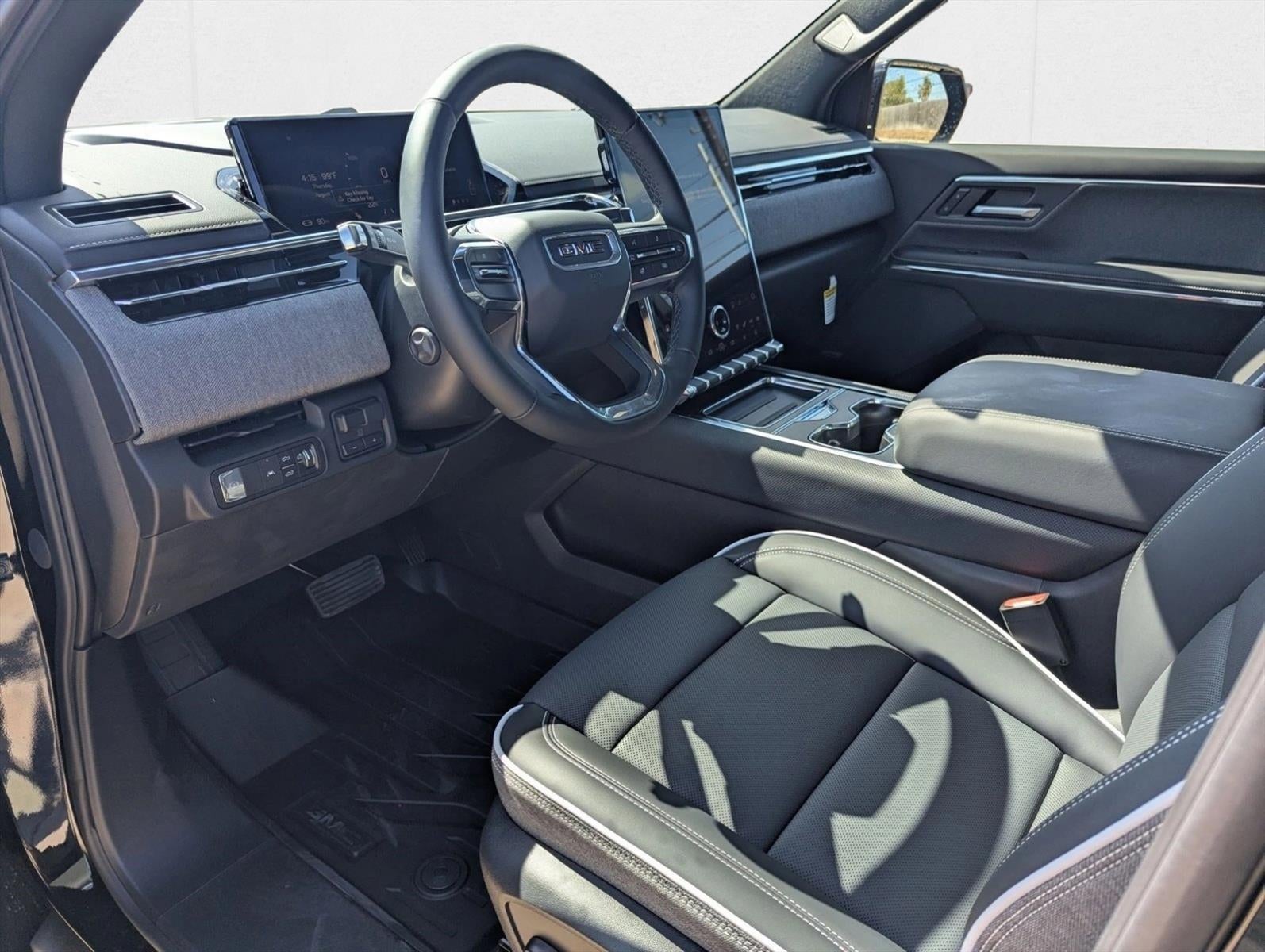 2026 GMC Sierra EV — rear three-quarter view