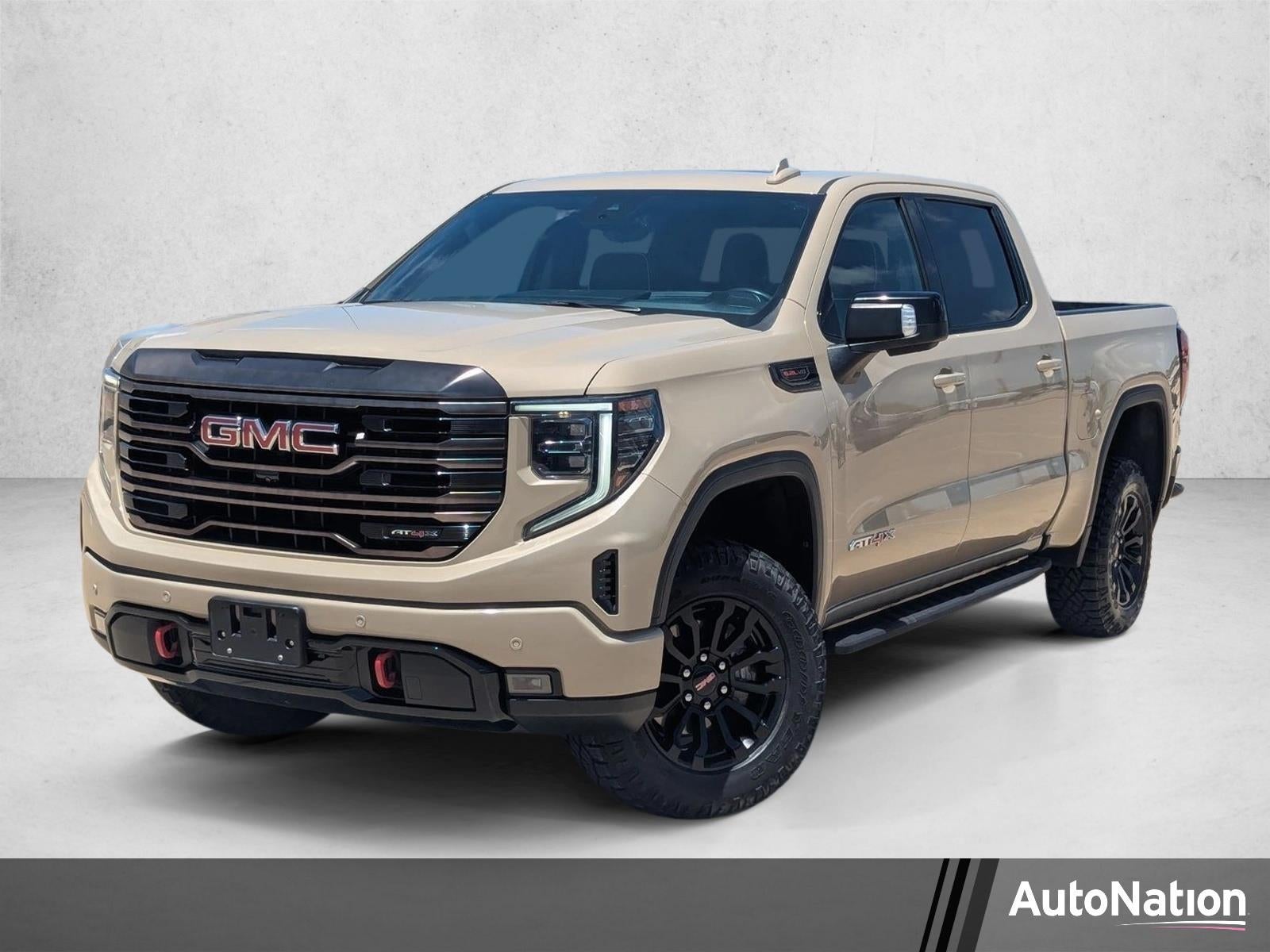 2022 GMC Sierra 1500 AT4X in Desert Sand Metallic — front three-quarter view
