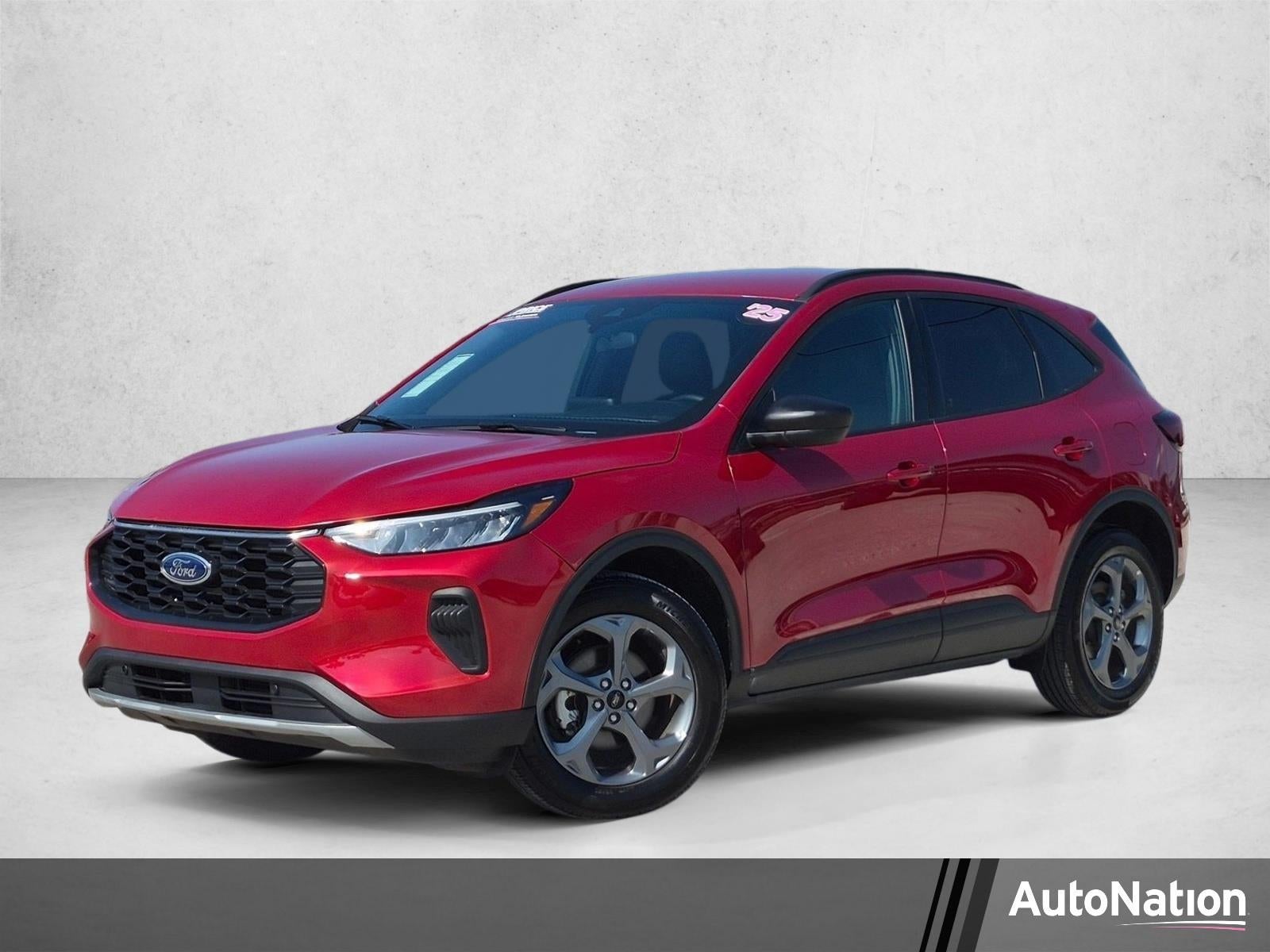 2025 Ford Escape ST-Line AWD in Rapid Red Metallic Tinted Clearcoat — front three-quarter view