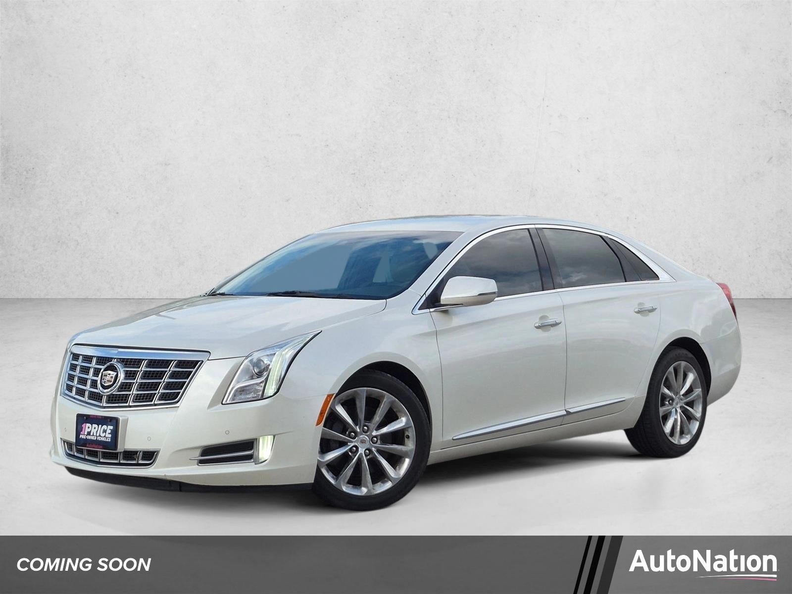 2013 Cadillac XTS 3.6L V6 FWD Luxury in White Diamond Tricoat — front three-quarter view