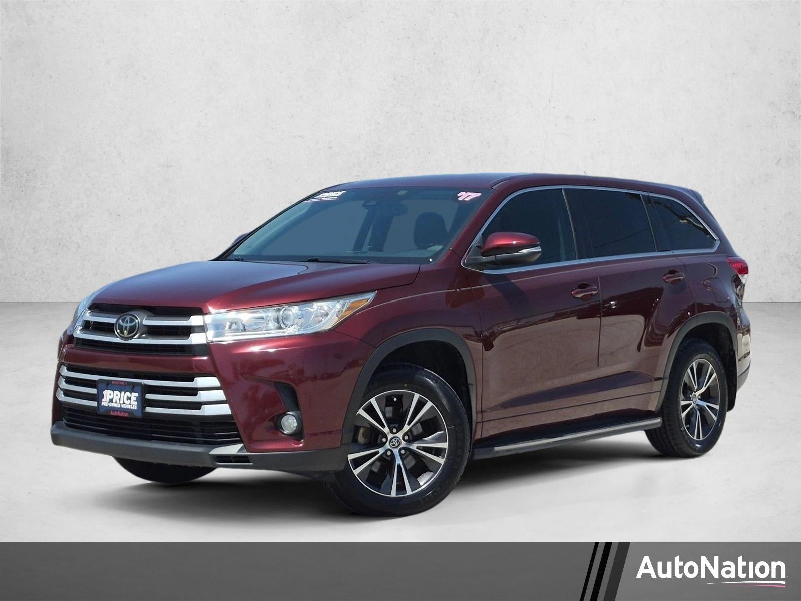 2017 Toyota Highlander LE Plus V6 FWD (SE) in Ooh La La Rouge Mica — front three-quarter view